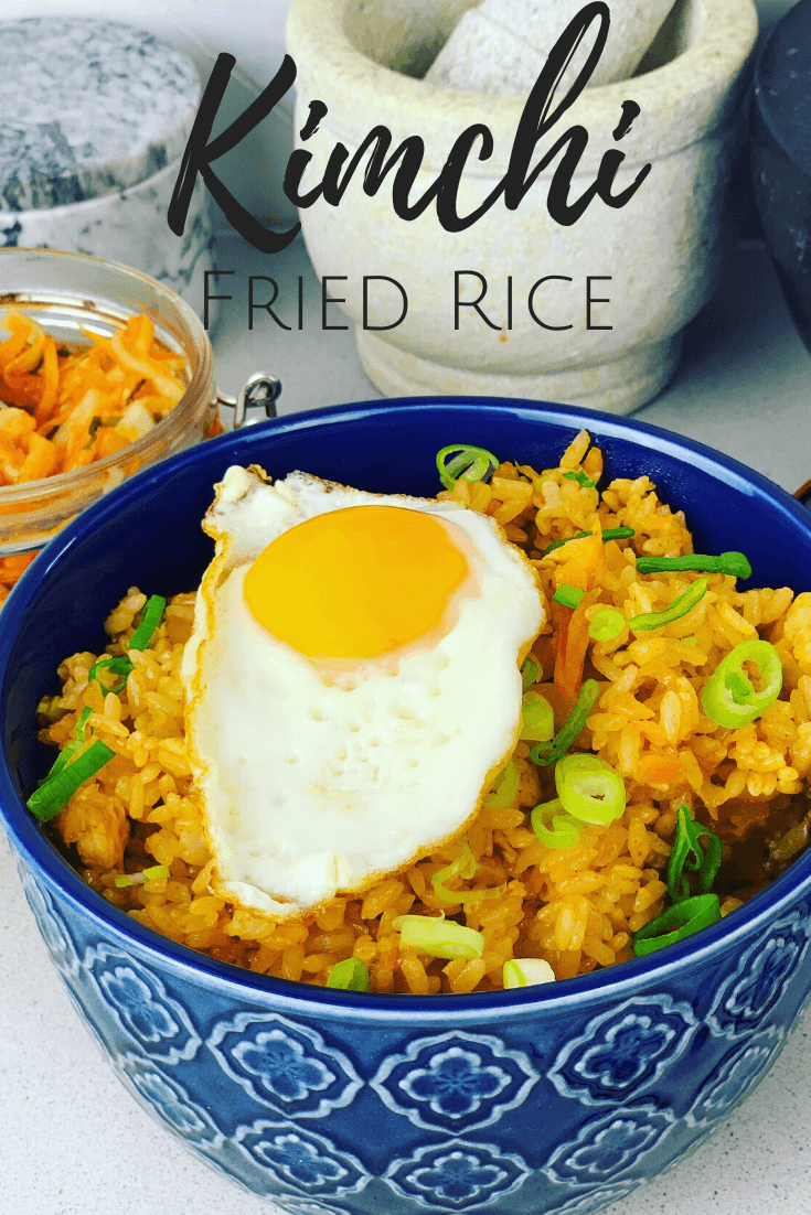 A Kimchi Fried Rice recipe that will feed a family. Made with chicken, but often made as a vegetarian recipe. So easy to make, packed with flavor, and can be done in 30 minutes. You want want boring fried rice after eating this delicious recipe! Kimchi Bokkeumbap.