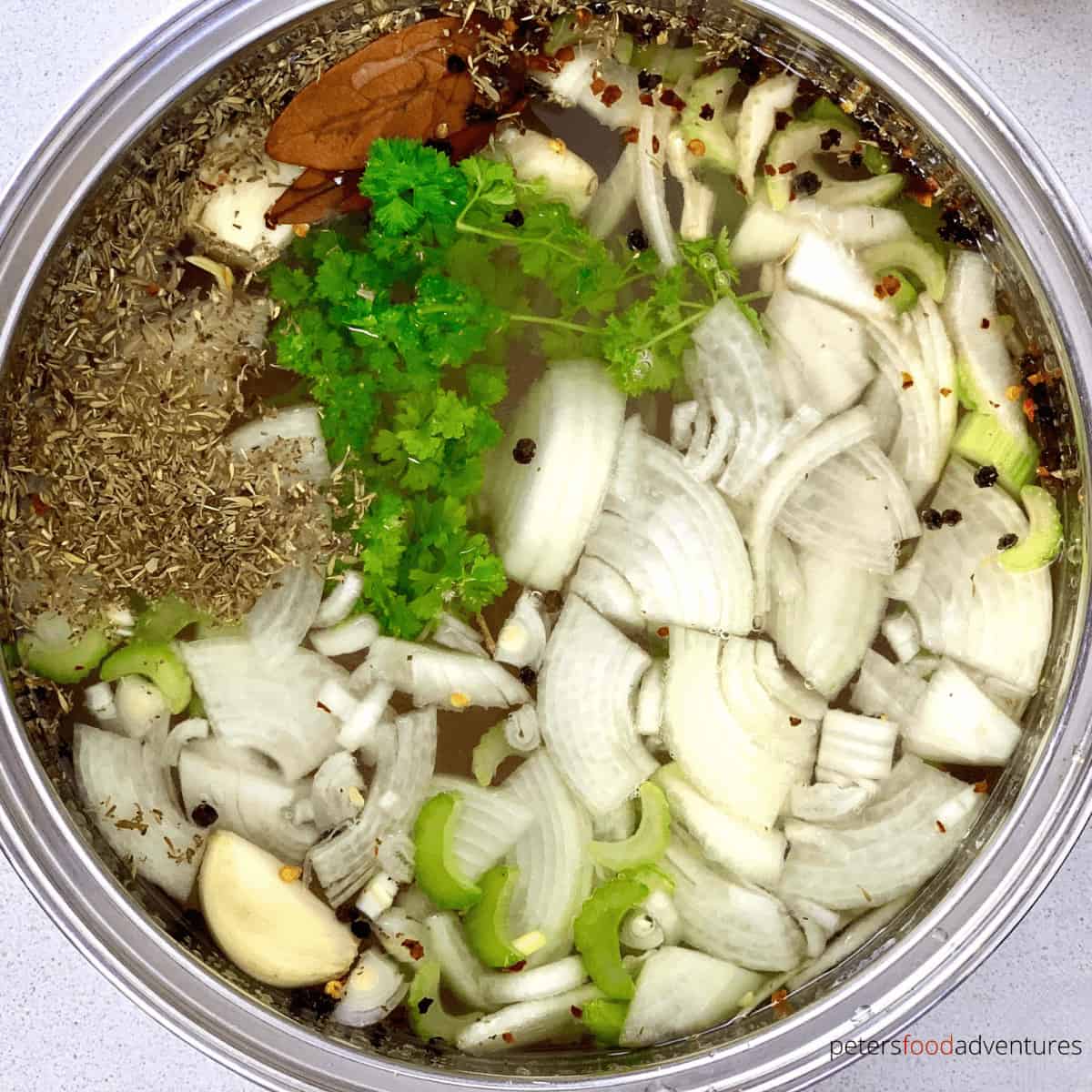 chicken brine with onion and herbs in a pot