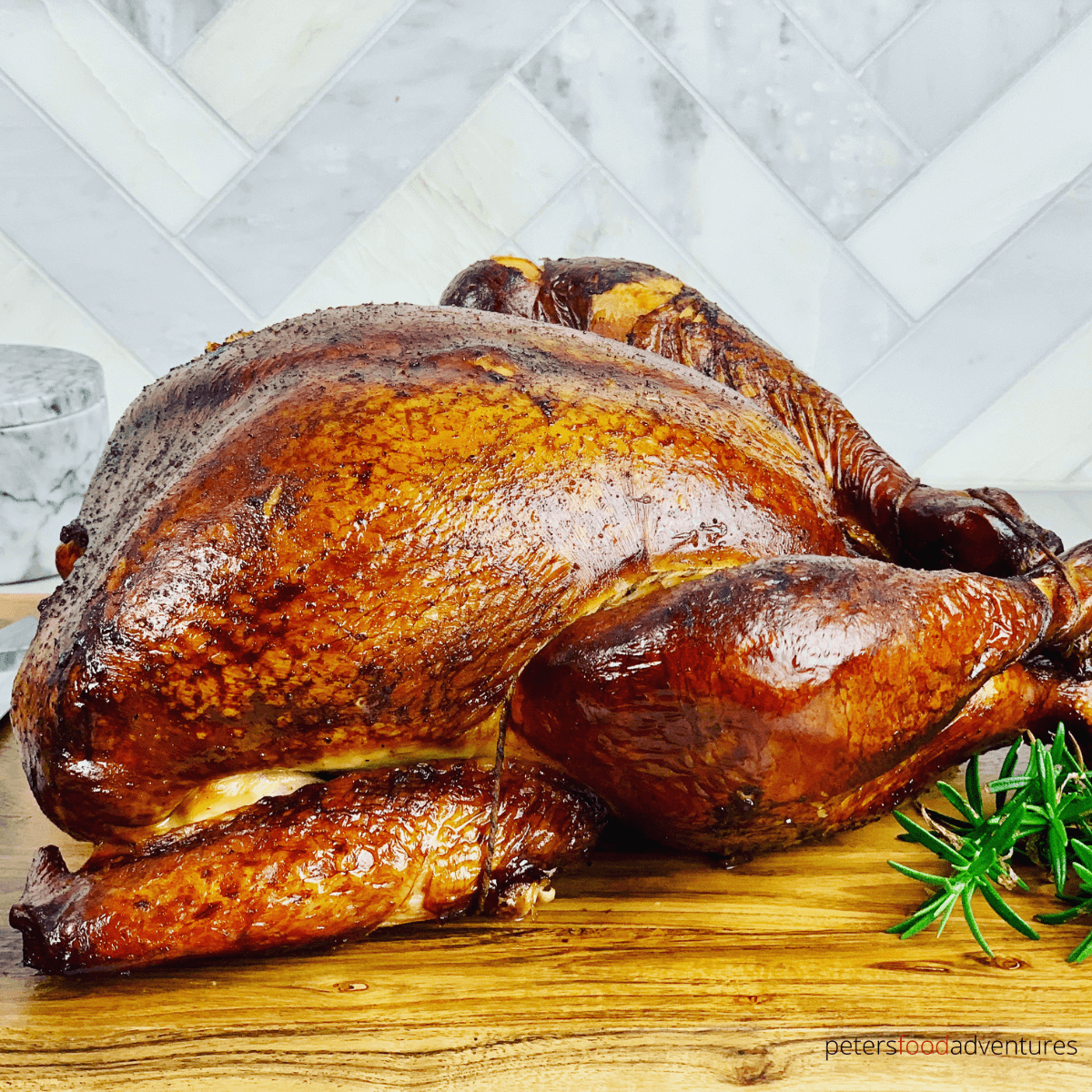 This smoked turkey is juicy and full of flavor. Brined overnight before being smoked in an offset smoker. A juicy and tender smoked turkey recipe, perfect for Thanksgiving or Christmas!