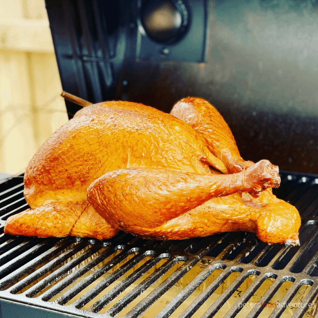 smoking a turkey on a grill in an offset smoker