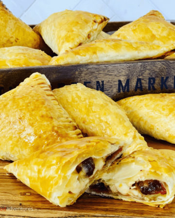 Delicious Leftover Thanksgiving turkey turnovers with cranberries, Swiss cheese and a sprinkle of thinly sliced onions. The only turkey leftovers recipe you’ll need these holidays!