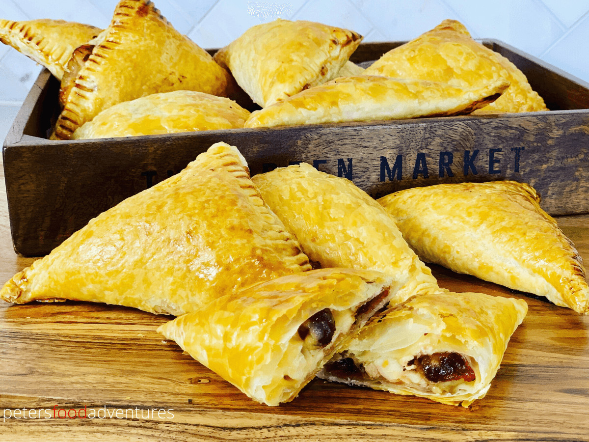 Delicious Leftover Thanksgiving turkey turnovers with cranberries, Swiss cheese and a sprinkle of thinly sliced onions. The only turkey leftovers recipe you’ll need these holidays!