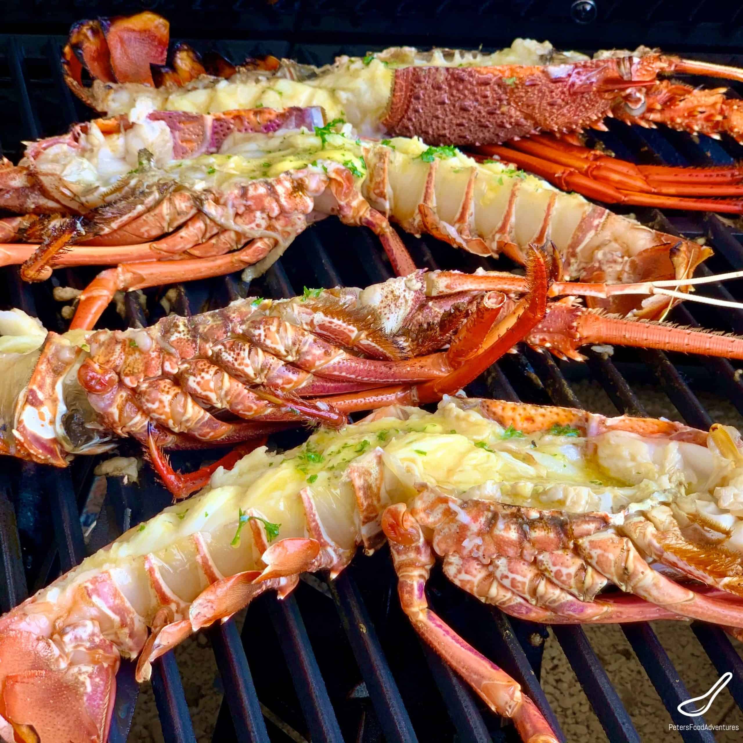 Grilling lobsters with garlic butter and parsley
