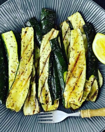 An easy and tasty way to serve a char grilled zucchini recipe. No complicated ingredients, a simple barbecued side dish that looks a little fancy.