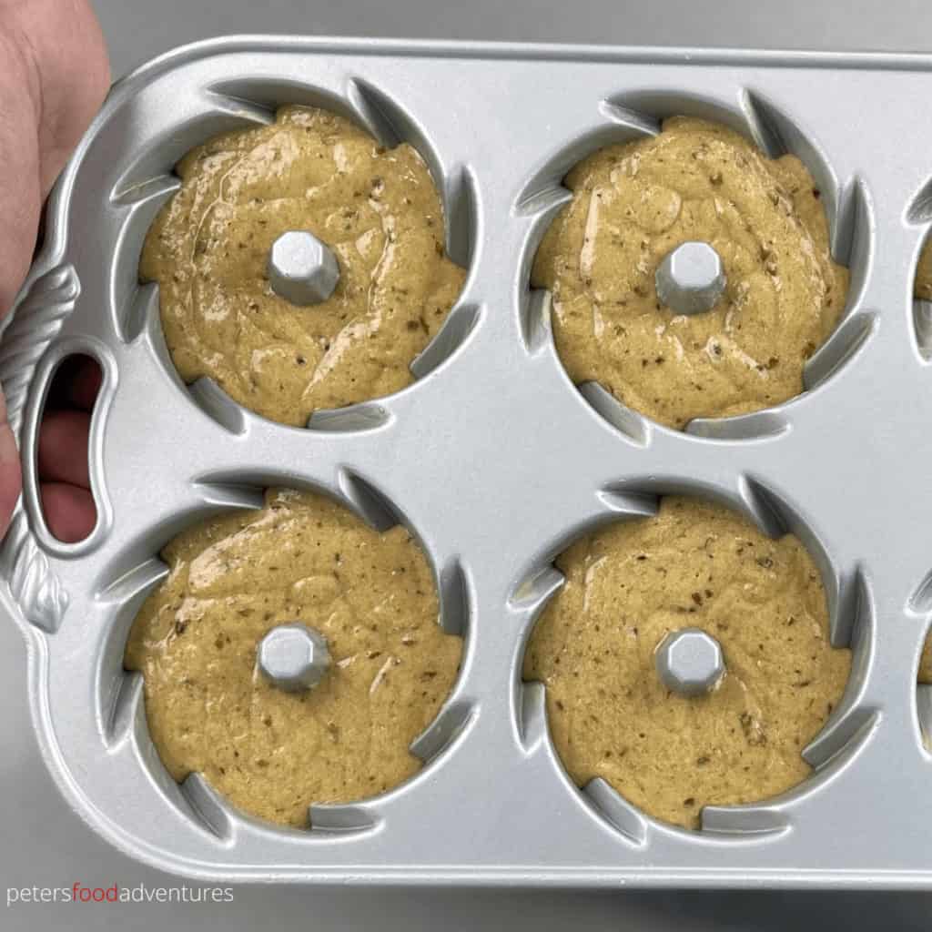 sticky date pudding batter inside a bundtlette pan