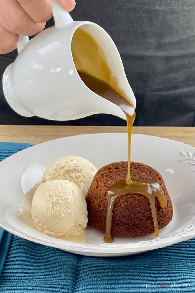 pouring caramel on sticky toffee pudding