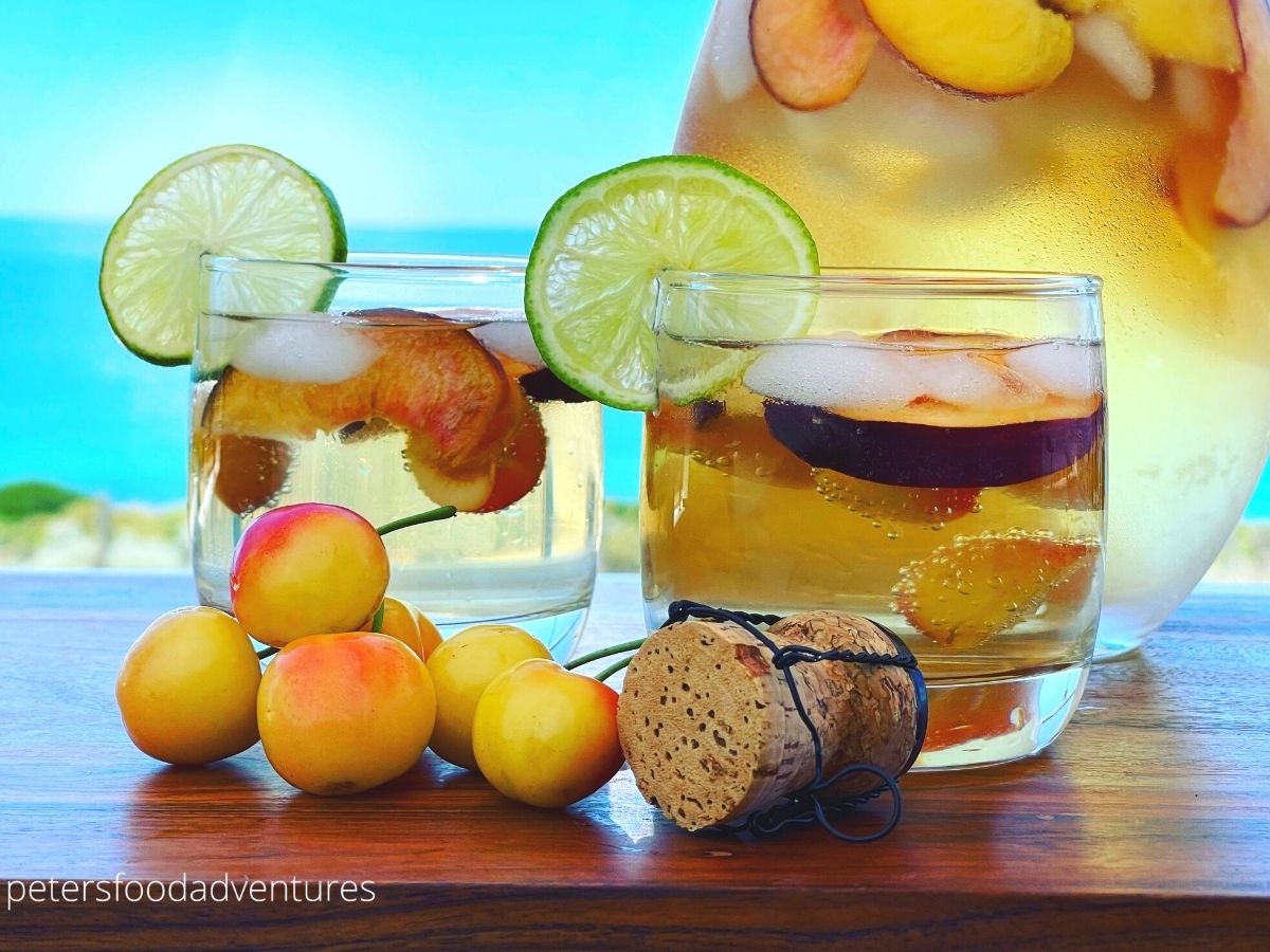 white sangria with white cherries in glasses