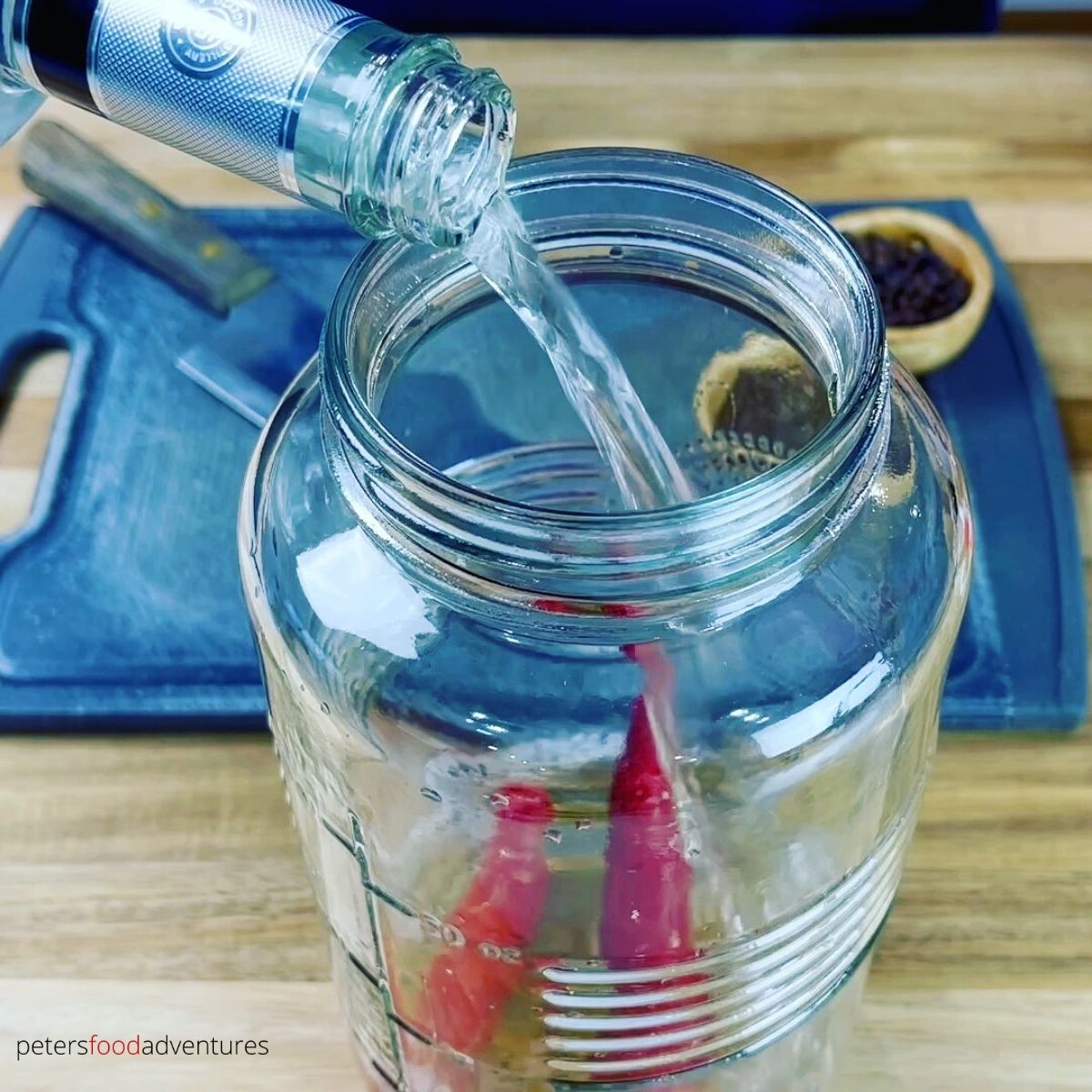 pouring vodka in a jar