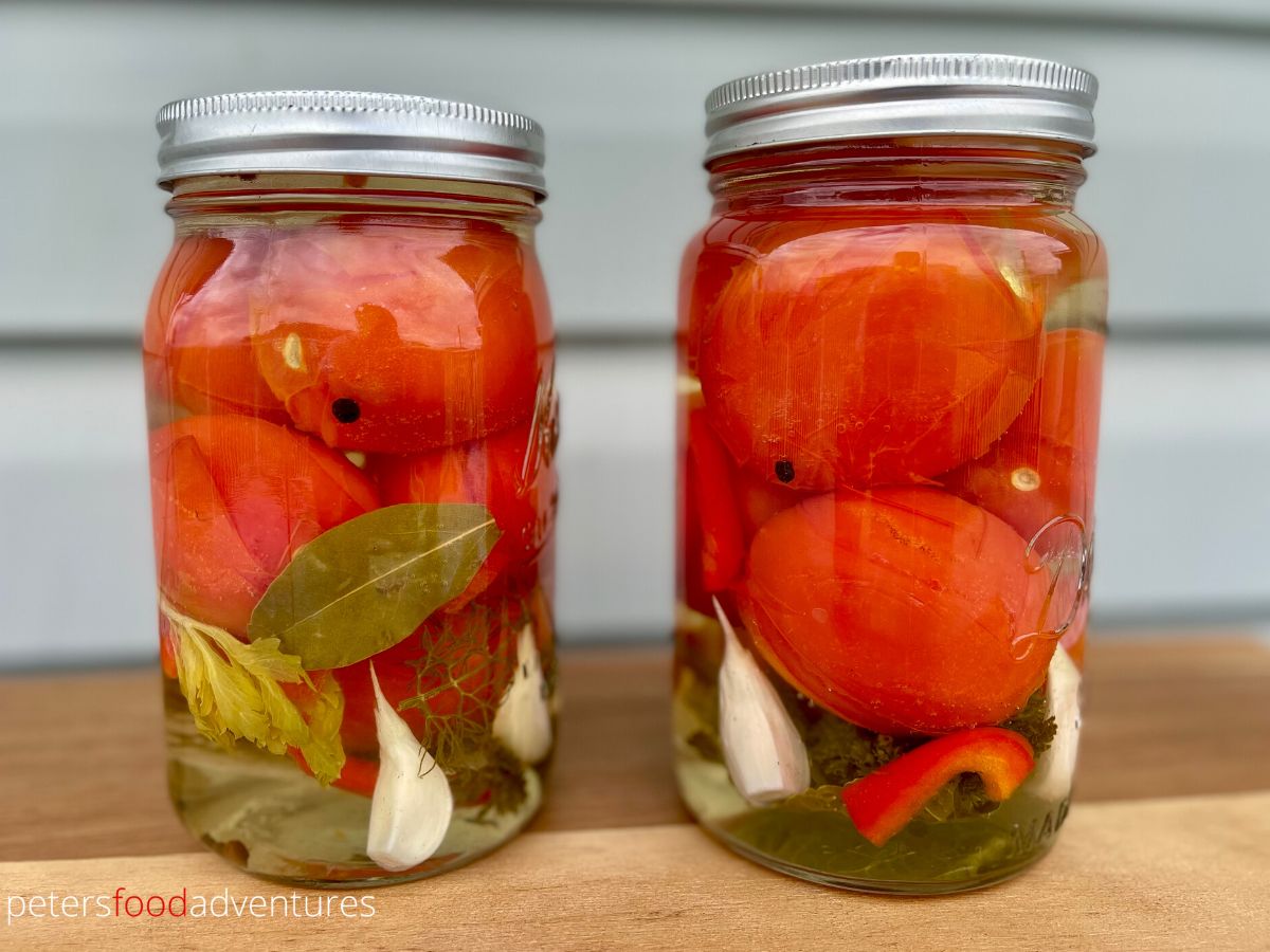 canned whole tomatoes in glass jars