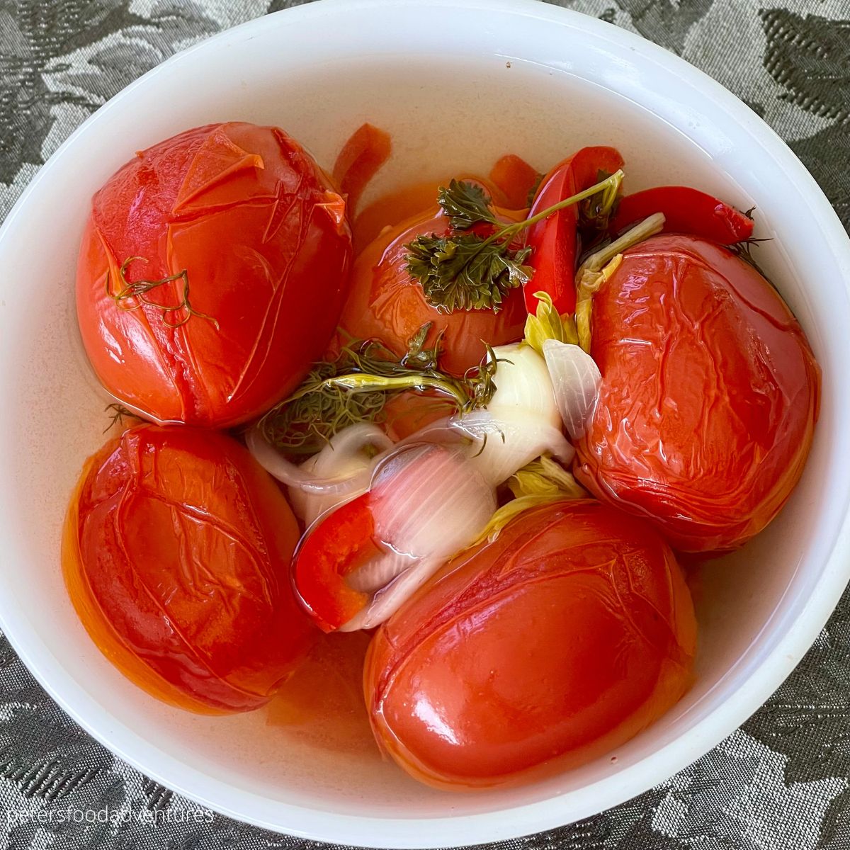 bowl of whole pickled tomatoes