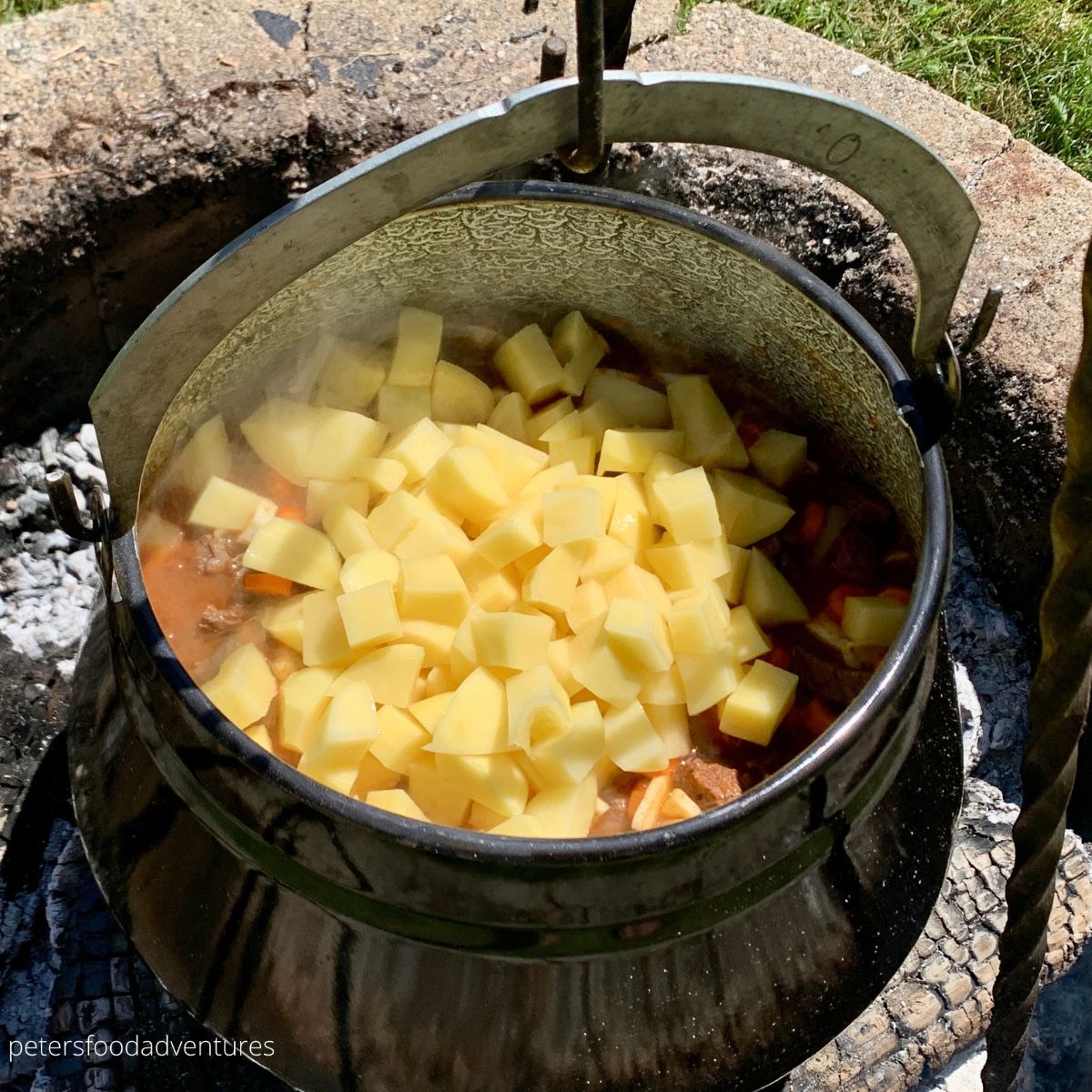 adding potatoes into cauldron