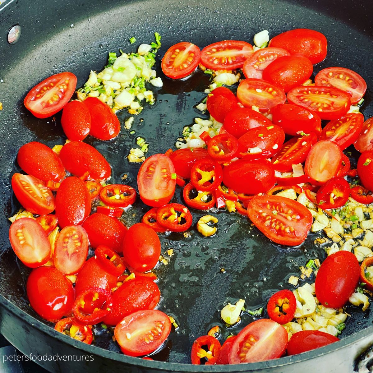 frying tomatoes and garlic