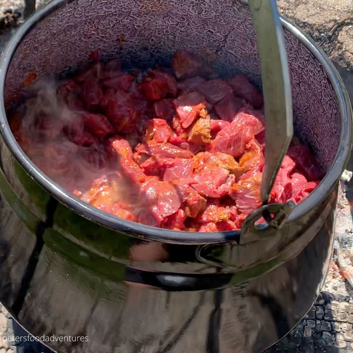 frying beef in a pot