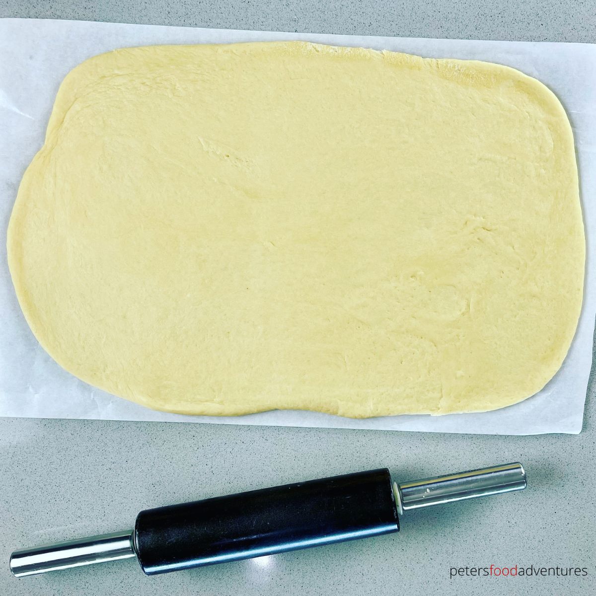 rolling dough on sheet pan