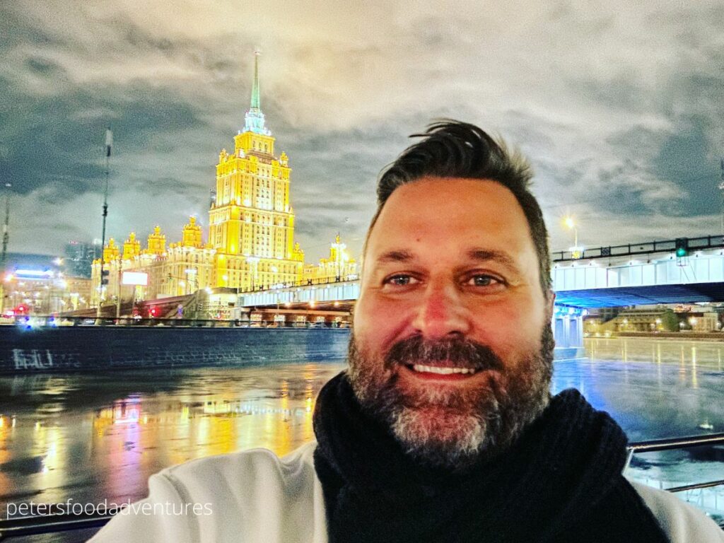 man standing in moscow at night in winter