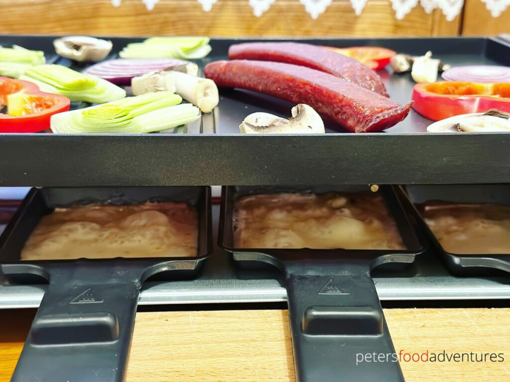 melting cheese raclette under grill
