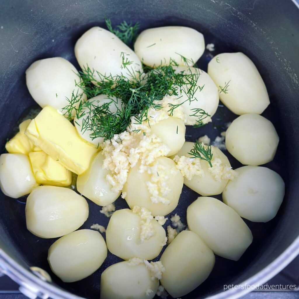 tossing potatoes in garlic butter