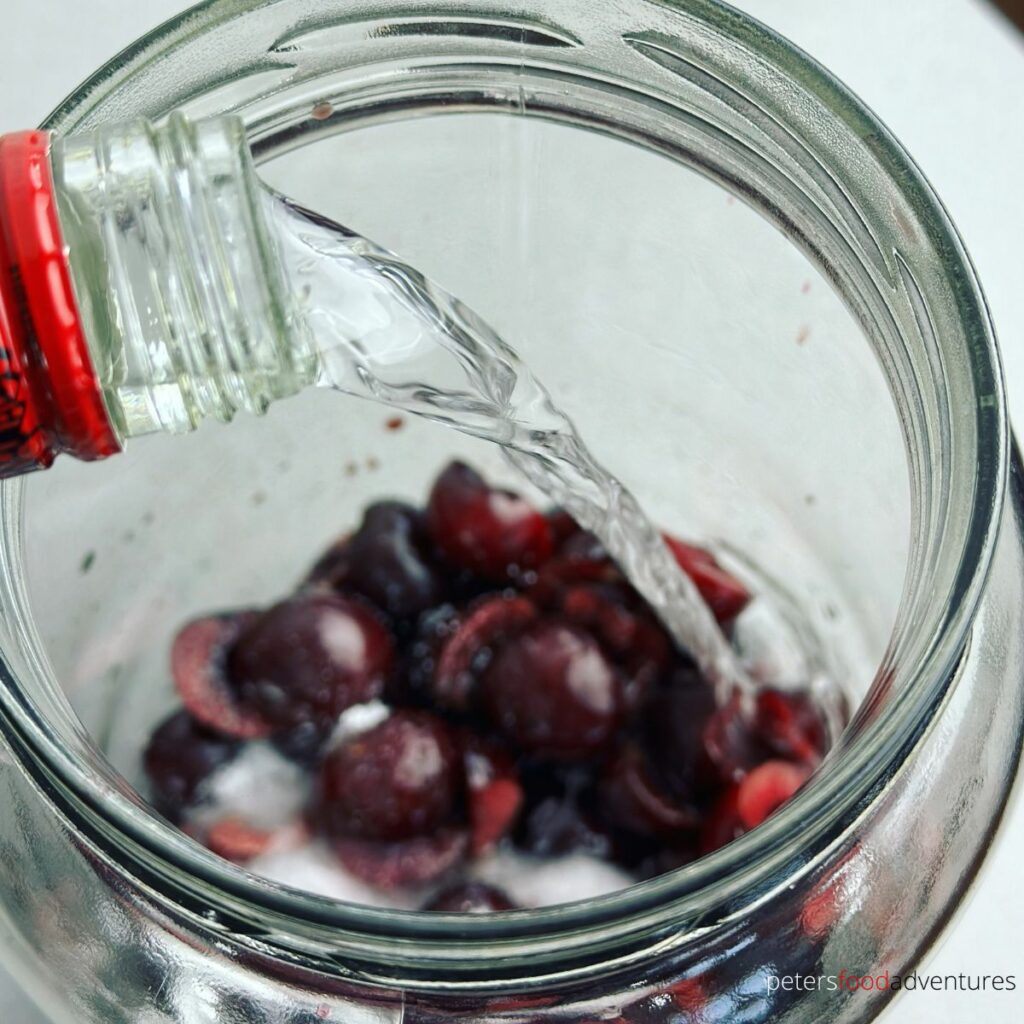 pouring vodka into jar