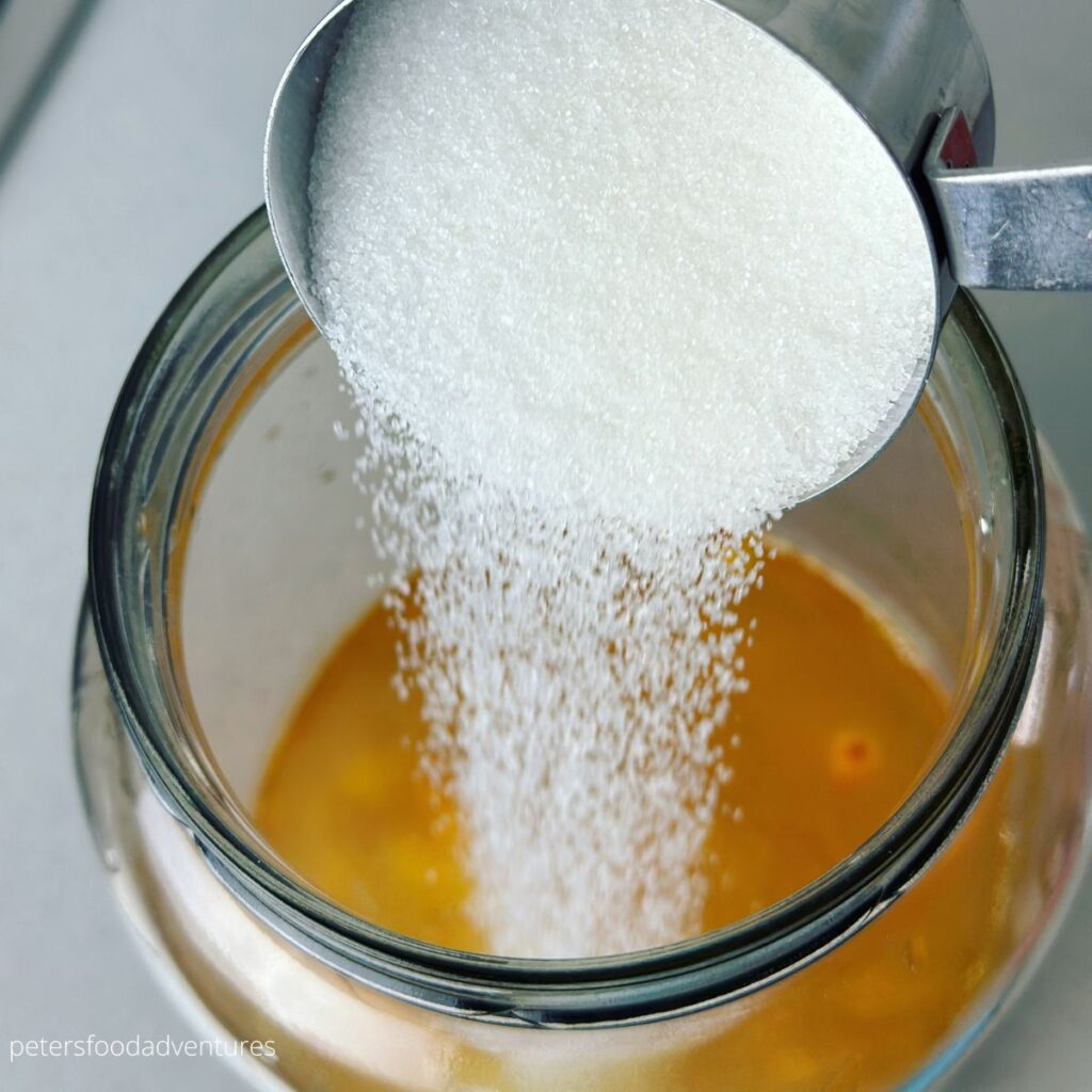 pouring sugar in jar